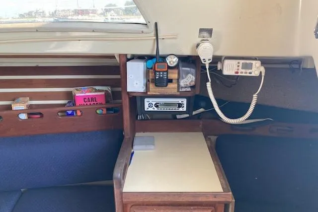 Slide: The Image of Interior of 1985 O'Day 28 sailboat with navigation equipment and storage compartments. - 14