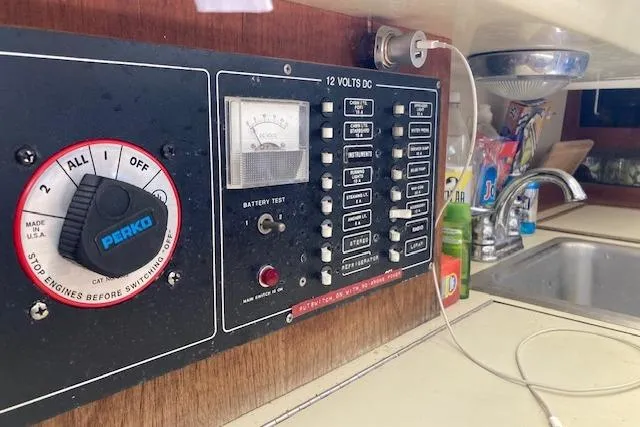 Slide: The Image of Control panel and sink area inside a 1985 O'Day 28 sailboat. - 15