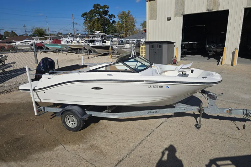 Slide: The Image of 2017 Sea Ray SPX 190 Outboard boat on trailer in marina setting. - 0