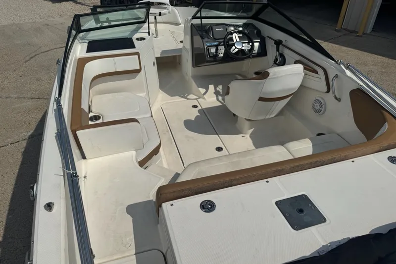 Slide: The Image of 2017 Sea Ray SPX 190 Outboard boat interior with white seating and speaker. - 10