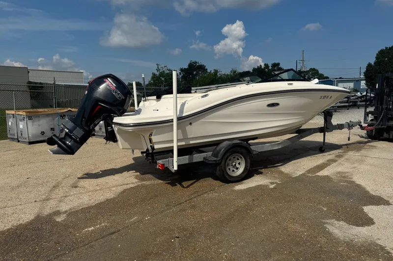 Slide: The Image of 2017 Sea Ray SPX 190 Outboard boat on trailer, parked outdoors on sunny day. - 4