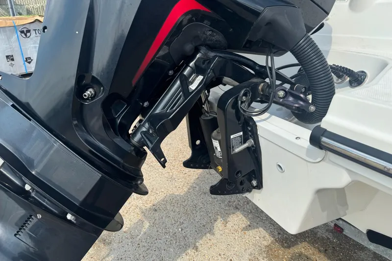 Slide: The Image of 2017 Sea Ray SPX 190 Outboard boat on trailer, parked outside a workshop. - 6