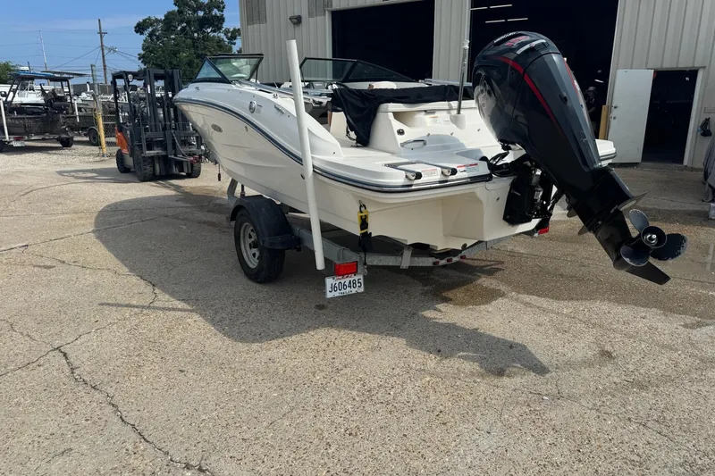 Slide: The Image of 2017 Sea Ray SPX 190 Outboard boat with powerful engine, parked on concrete surface. - 7