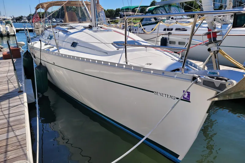 Slide: The Image of 1999 Beneteau Oceanis 351 sailboat docked at marina, side view. - 0