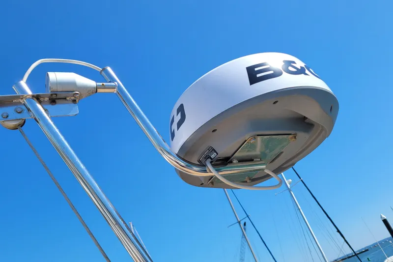 Slide: The Image of Radar equipment on a 1999 Beneteau Oceanis 351 sailboat against a clear blue sky. - 12