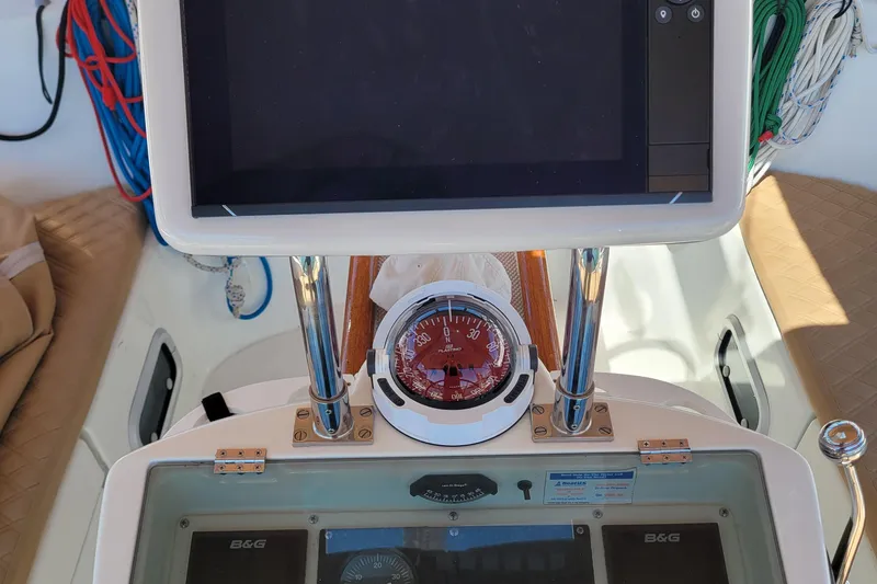 Slide: The Image of Cockpit of 1999 Beneteau Oceanis 351 sailboat with navigation instruments and compass. - 14