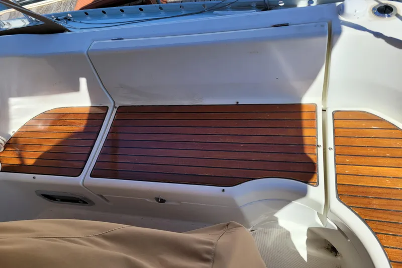 Slide: The Image of Teak deck of 1999 Beneteau Oceanis 351 sailboat, showcasing elegant wood finish. - 18