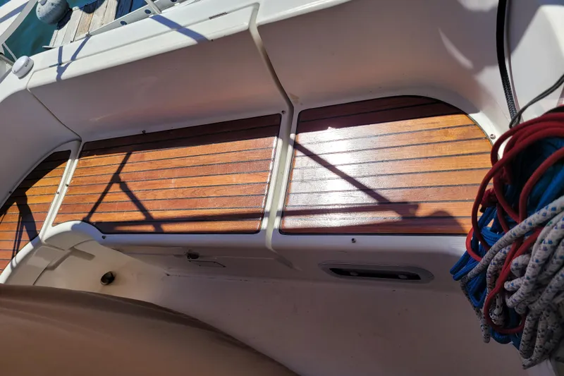 Slide: The Image of Teak deck of 1999 Beneteau Oceanis 351 sailboat with coiled ropes. - 20