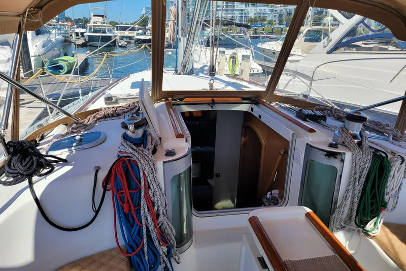 Slide: The Image of Cockpit view of 1999 Beneteau Oceanis 351 sailboat docked at marina. - 22