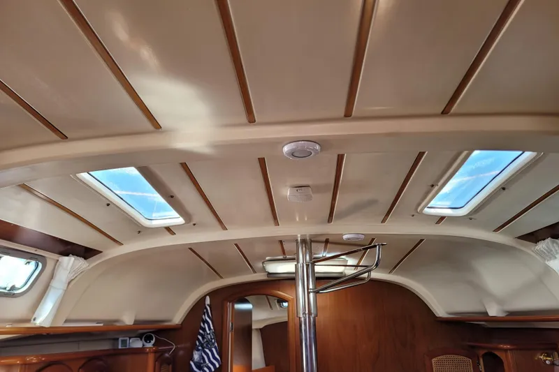 Slide: The Image of Interior view of 1999 Beneteau Oceanis 351 sailboat cabin with skylights and wood accents. - 30