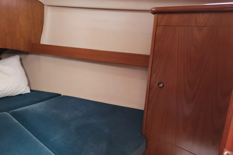 Slide: The Image of Cozy cabin interior of 1999 Beneteau Oceanis 351 sailboat with wooden cabinetry. - 32