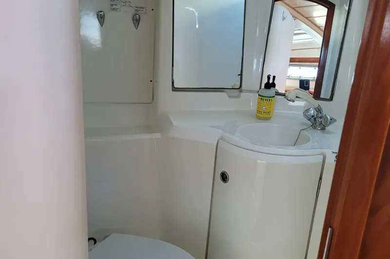 Slide: The Image of Bathroom interior of 1999 Beneteau Oceanis 351 yacht, featuring sink and mirror. - 41