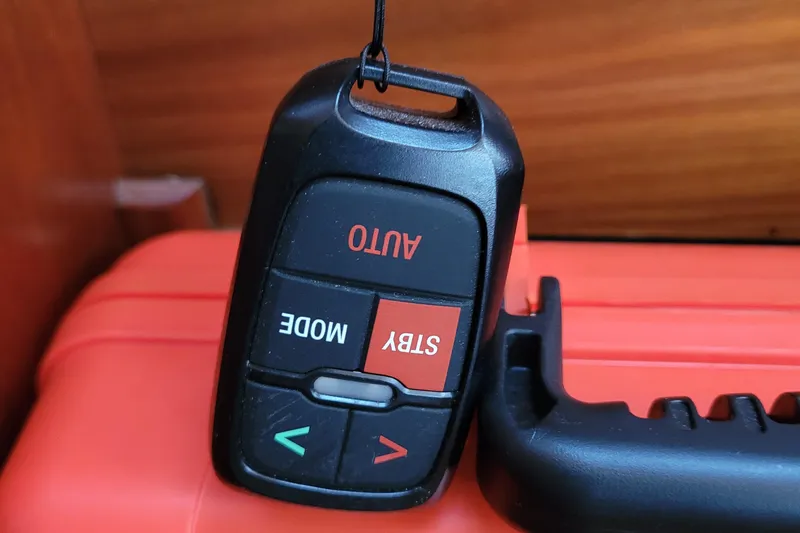 Slide: The Image of Remote control for Beneteau Oceanis 351 yacht, featuring auto and standby buttons. - 46