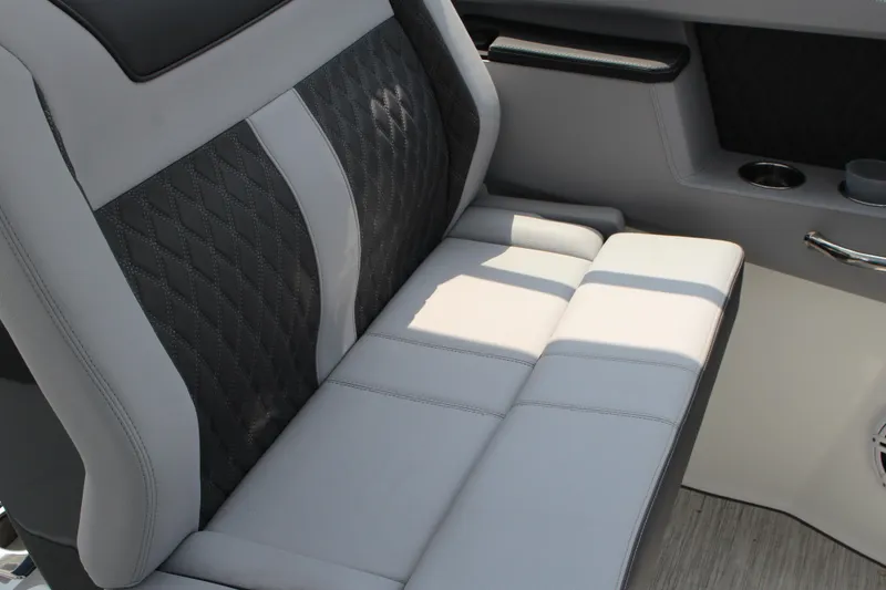 Slide: The Image of Luxurious seating in 2025 Cobalt R35 boat with quilted upholstery and cup holders. - 19