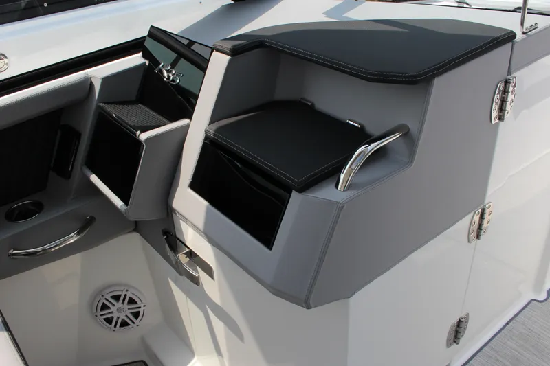 Slide: The Image of Interior of 2025 Cobalt R35 boat featuring sleek storage compartments and modern design. - 23