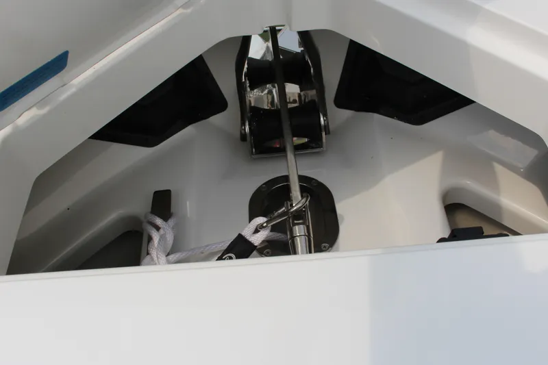Slide: The Image of Anchor compartment of 2025 Cobalt R35 boat with rope and metal fittings. - 27