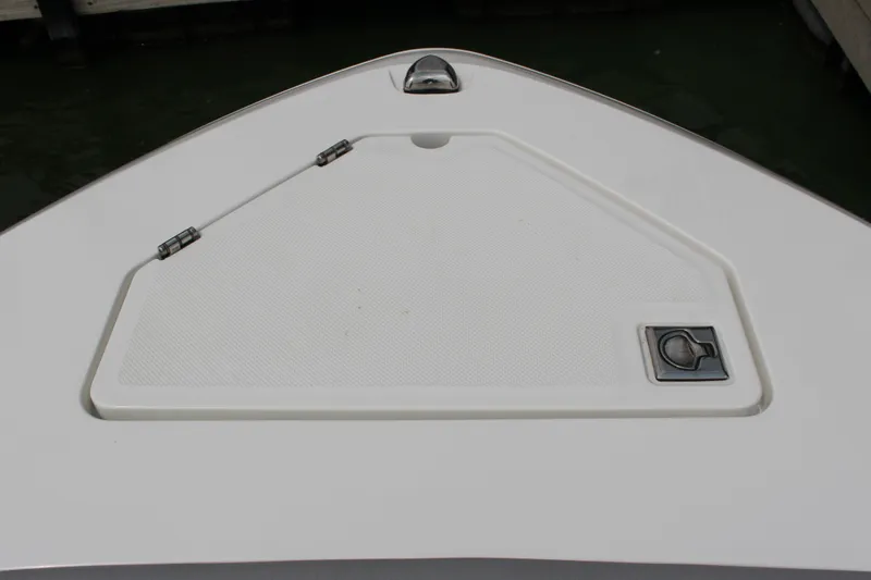 Slide: The Image of Bow storage compartment on 2025 Cobalt R35 boat, featuring sleek design and secure latch. - 28