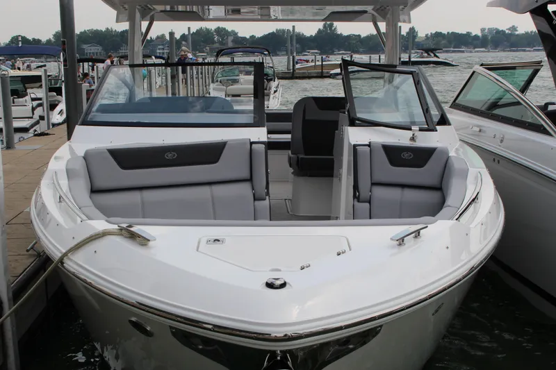 Slide: The Image of 2025 Cobalt R35 boat docked at marina, featuring sleek design and spacious seating. - 35