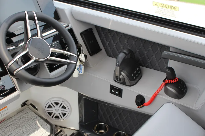 Slide: The Image of Interior of 2025 Cobalt R35 boat with steering wheel and control panel. - 4