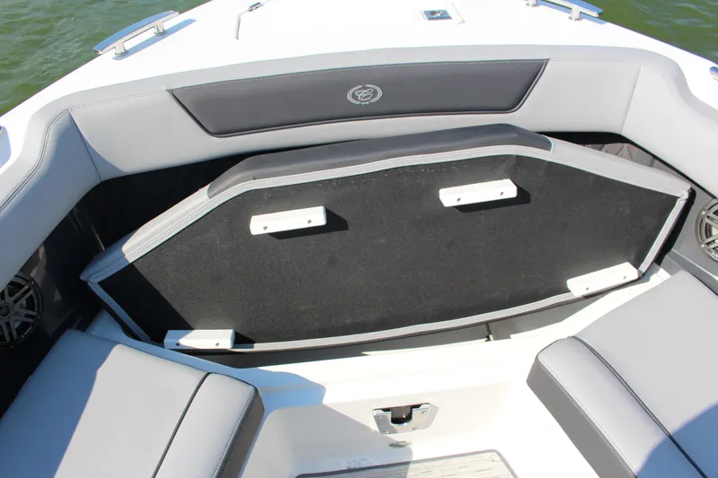 Slide: The Image of 2025 Cobalt R35 boat interior with open storage compartment and cushioned seating. - 41