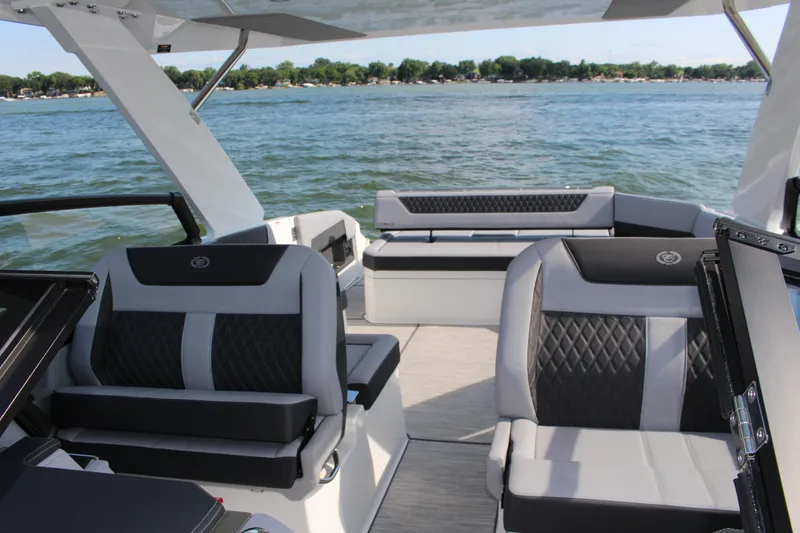 Slide: The Image of Luxurious interior of 2025 Cobalt R35 boat with stylish seating on a serene lake. - 46