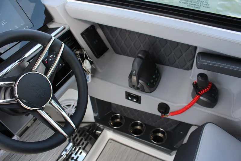Slide: The Image of Interior of 2025 Cobalt R35 boat with steering wheel and control panel. - 49