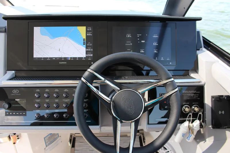 Slide: The Image of Helm of 2025 Cobalt R35 boat with Garmin navigation display and control panel. - 55