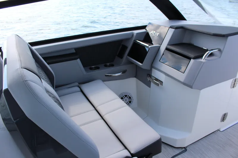 Slide: The Image of Interior of 2025 Cobalt R35 boat with modern seating and control panel. - 58