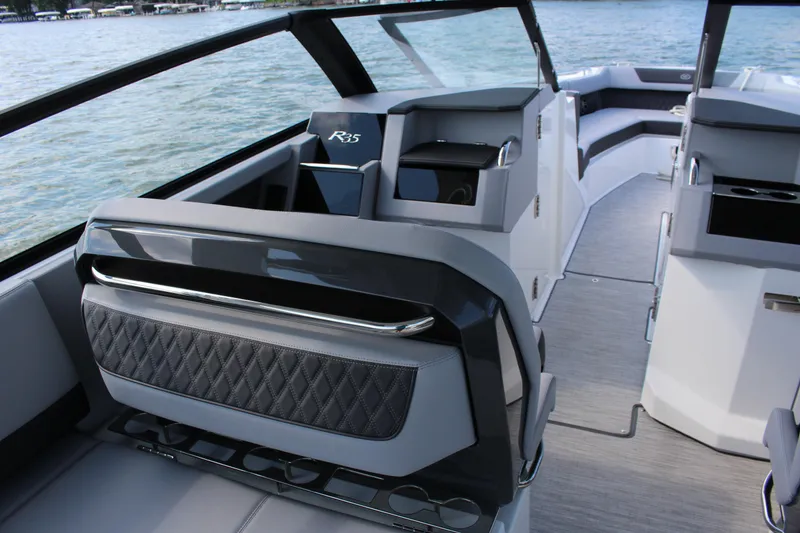Slide: The Image of Interior of 2025 Cobalt R35 boat with modern seating and sleek design. - 59