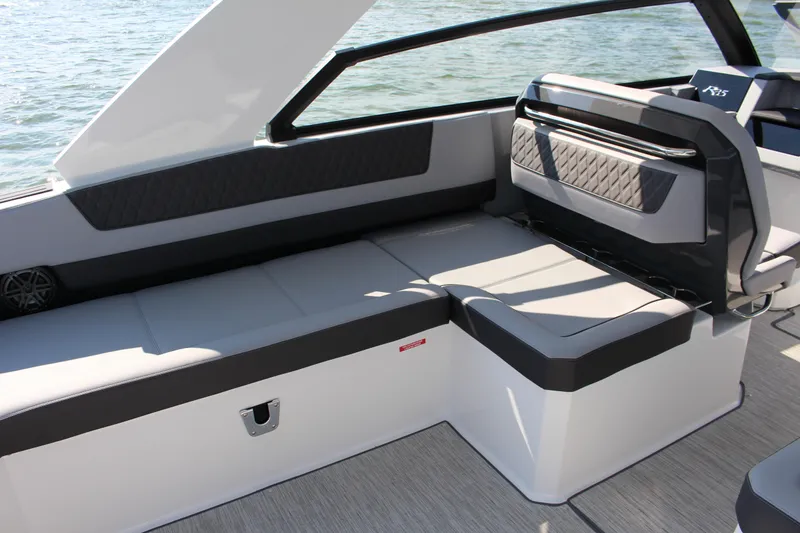 Slide: The Image of 2025 Cobalt R35 boat interior with sleek seating and modern design on the water. - 64