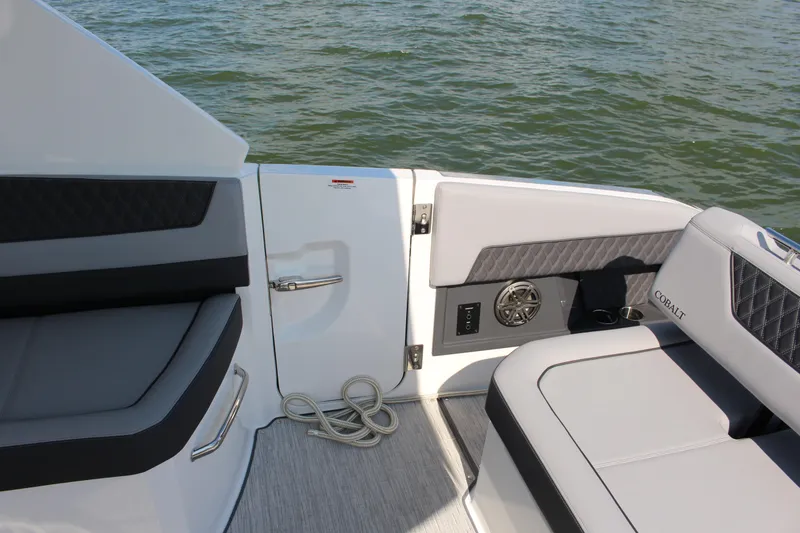 Slide: The Image of Interior of 2025 Cobalt R35 boat with gray seating and water view. - 68