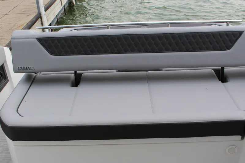 Slide: The Image of 2025 Cobalt R35 boat seat with sleek design and waterfront view. - 7