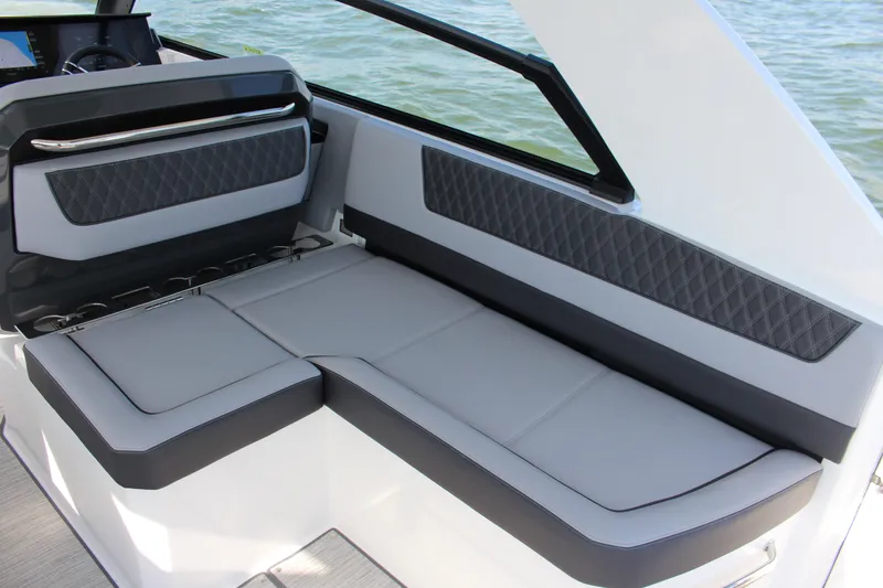 Slide: The Image of Luxurious seating on 2025 Cobalt R35 boat, featuring sleek gray upholstery and diamond-patterned accents. - 72