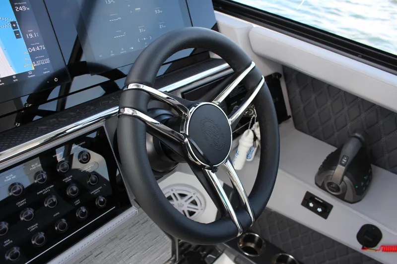Slide: The Image of Steering wheel and dashboard of 2025 Cobalt R35 boat with digital displays. - 74