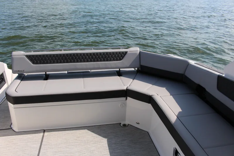 Slide: The Image of Luxurious seating on 2025 Cobalt R35 boat, overlooking serene water. - 81