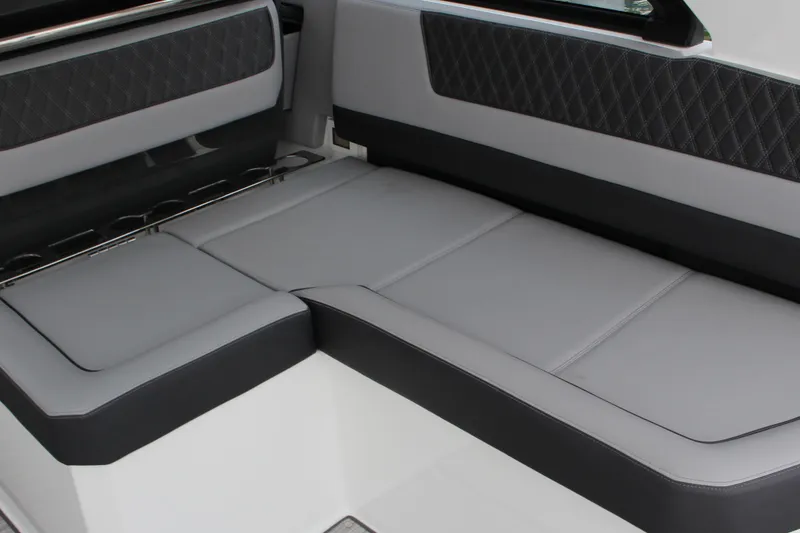 Slide: The Image of 2025 Cobalt R35 boat interior with sleek gray seating and diamond-patterned accents. - 9