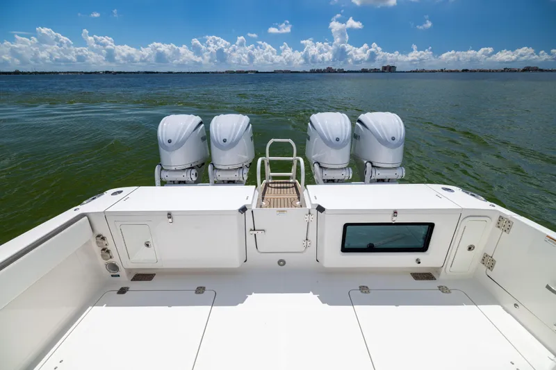 Slide: The Image of 2022 World Cat 400 CC-X boat with four engines on open water. - 19