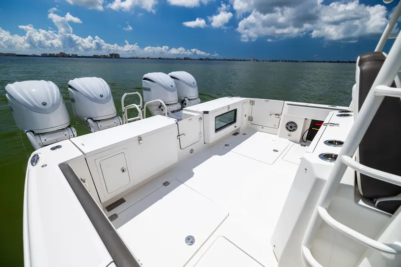 Slide: The Image of 2022 World Cat 400 CC-X boat with four engines, spacious deck, and ocean view. - 21