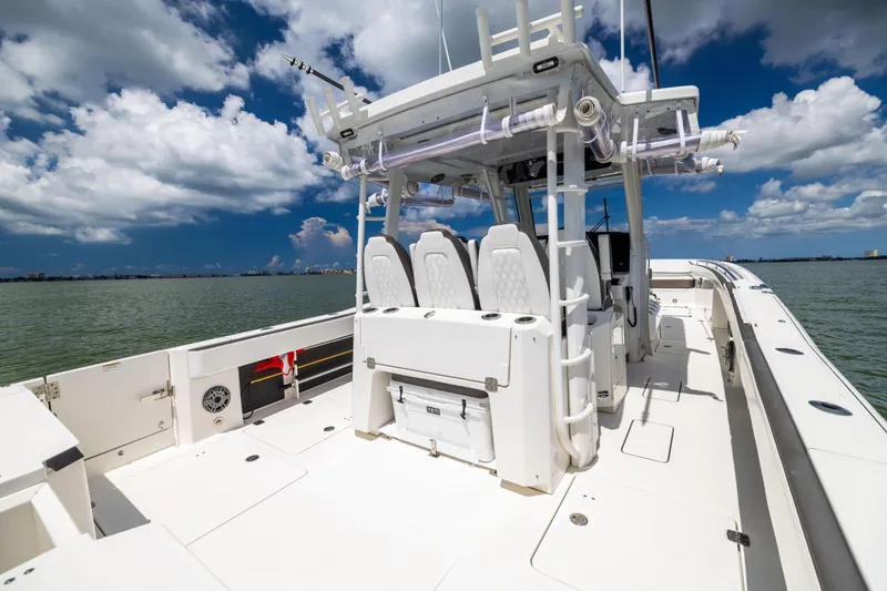 Slide: The Image of 2022 World Cat 400 CC-X boat on water, featuring spacious deck and seating. - 27