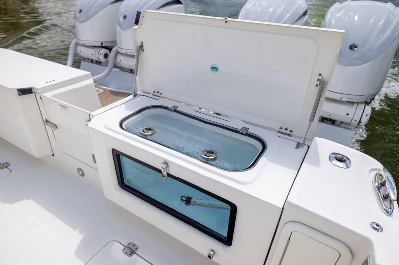 Slide: The Image of 2022 World Cat 400 CC-X boat with open livewell and powerful outboard engines. - 33