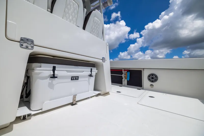 Slide: The Image of 2022 World Cat 400 CC-X boat deck with Yeti cooler under blue sky. - 35