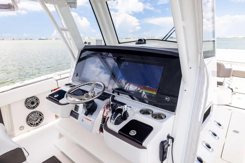 Slide: The Image of 2022 World Cat 400 CC-X helm with advanced navigation system and ocean view. - 43