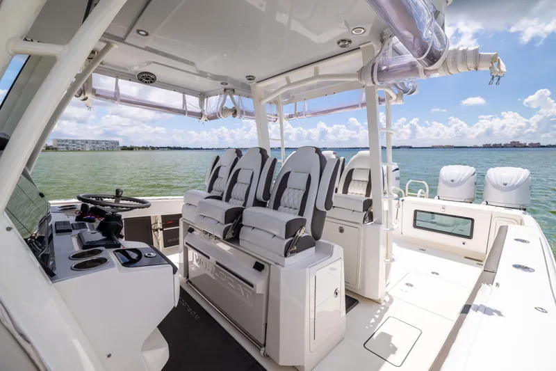 Slide: The Image of 2022 World Cat 400 CC-X boat interior with luxurious seating and modern helm. - 45