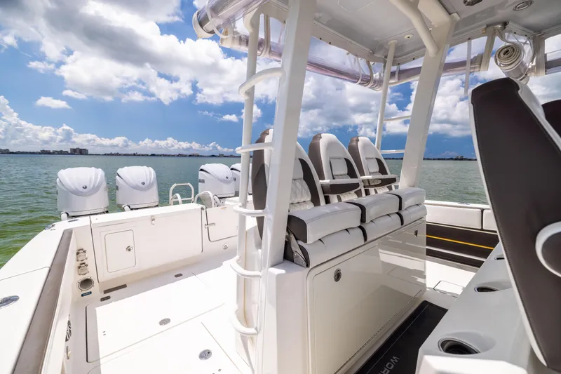 Slide: The Image of 2022 World Cat 400 CC-X boat interior with seating, ocean view, and clear sky. - 48