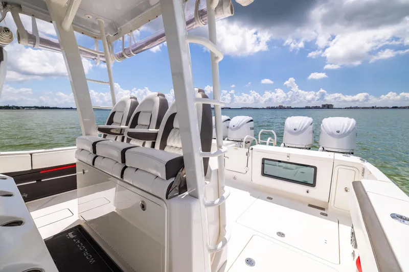 Slide: The Image of 2022 World Cat 400 CC-X boat interior with seating and ocean view. - 49