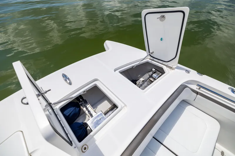 Slide: The Image of 2022 World Cat 400 CC-X boat with open storage compartments on deck. - 56