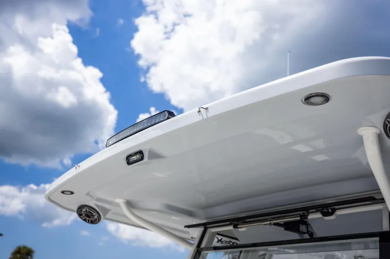 Slide: The Image of 2022 World Cat 400 CC-X boat roof against a cloudy sky. - 58