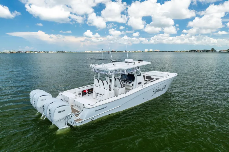 Slide: The Image of 2022 World Cat 400 CC-X boat on open water with Yamaha engines. - 6