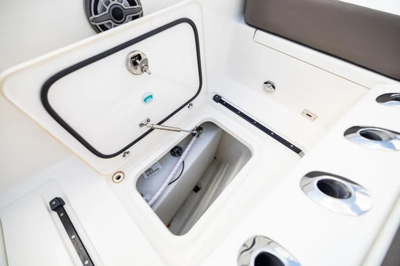 Slide: The Image of Open storage compartment on 2022 World Cat 400 CC-X boat, showcasing interior details. - 67