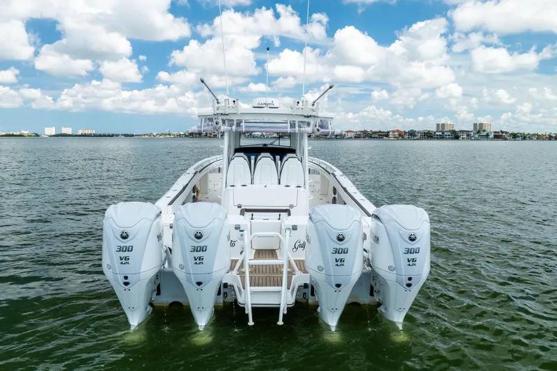 Slide: The Image of 2022 World Cat 400 CC-X boat with four Yamaha 300 V6 engines on open water. - 7